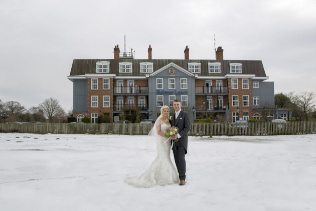 Balmer Lawn Hotel & Spa, front of hotel, snow on lawn with couple standing in it