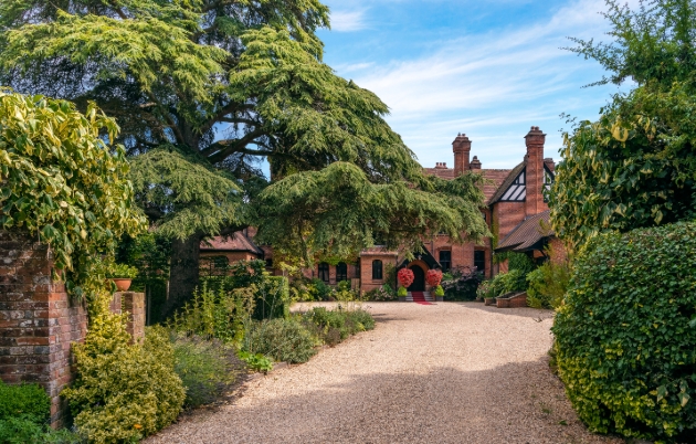 Careys Manor Hotel & SenSpa, red house surrounded by gardens