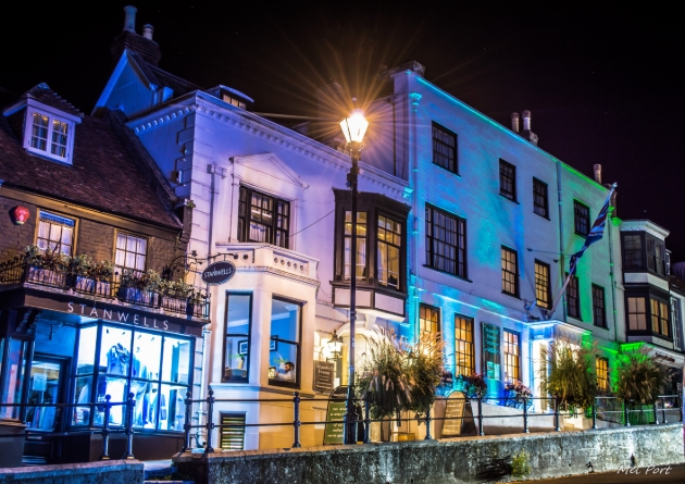 Stanwell House Hotel, white facade hotel on highstreet at night