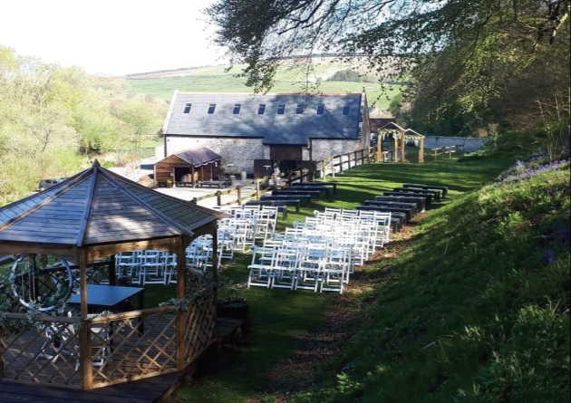 Gorwell Farm al fresco wedding set up under pagoda farm building in background