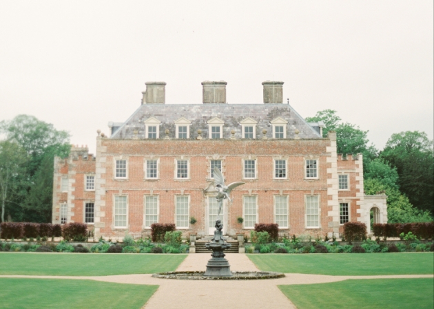 St Giles House, brick house manicured gardens with fountain