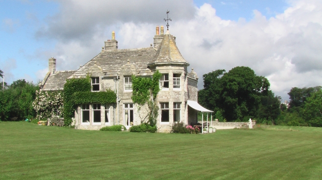 Harry Warren House, historic house on the grass sunny day