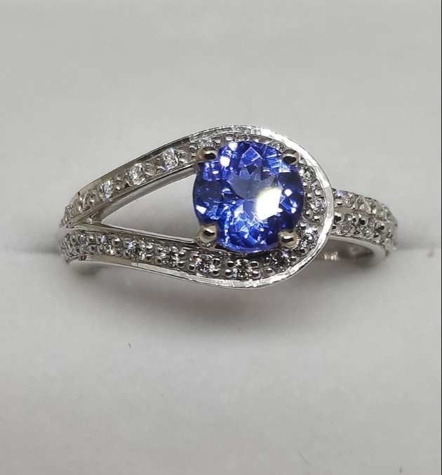 silver and diamond ring with sapphire stone