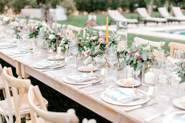 trestle table with flowers in middle