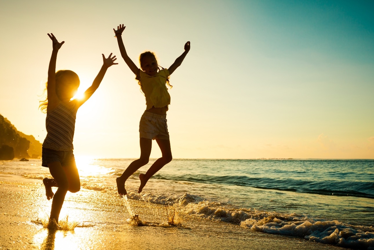 two kids jumping in air