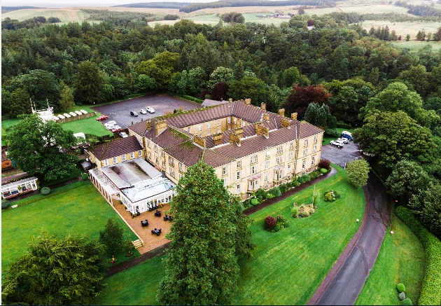 aerial view of hotel, grounds and surrounding countryside