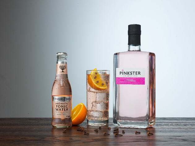 bottle of Pinkster Gin with glass and tonic water 