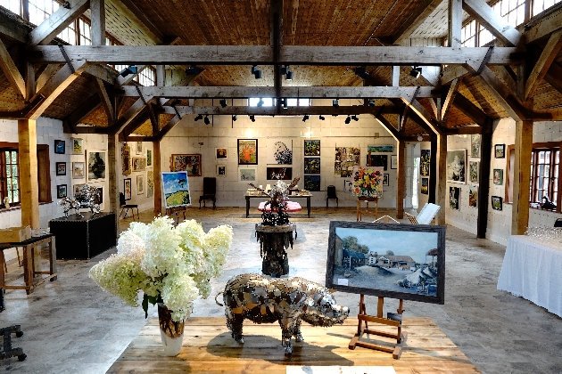 New arty venue barn interior with lots of arts and sculpture displayed
