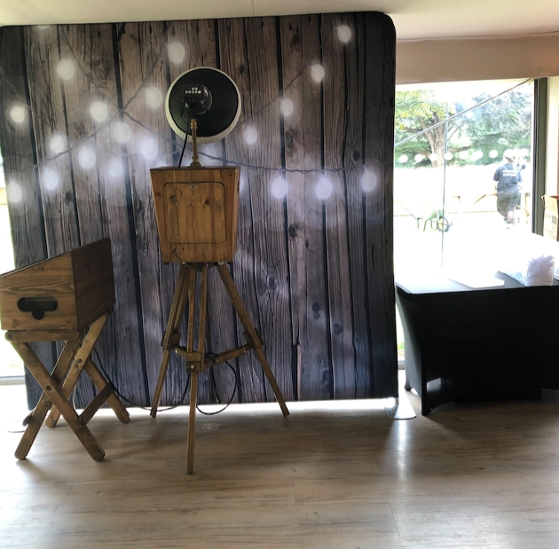backdrop photo booth wooden with tripod camera