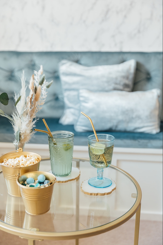blue decor and blue glasses on a gold table