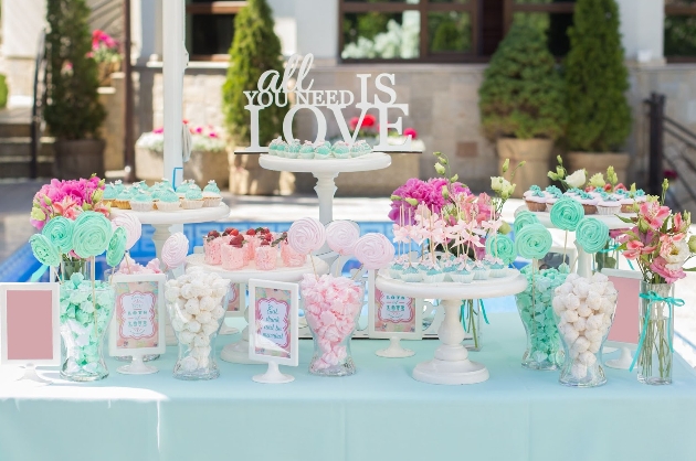 sweet table of blue and pink flavoured and coloured sweets