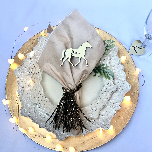 silver acrylic place setting with grooms written on it in script font