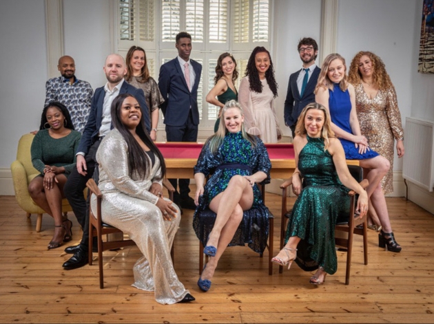 soul choir group in evening wear some standing some sat down