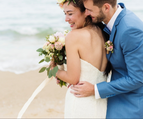 bride and groom on beach