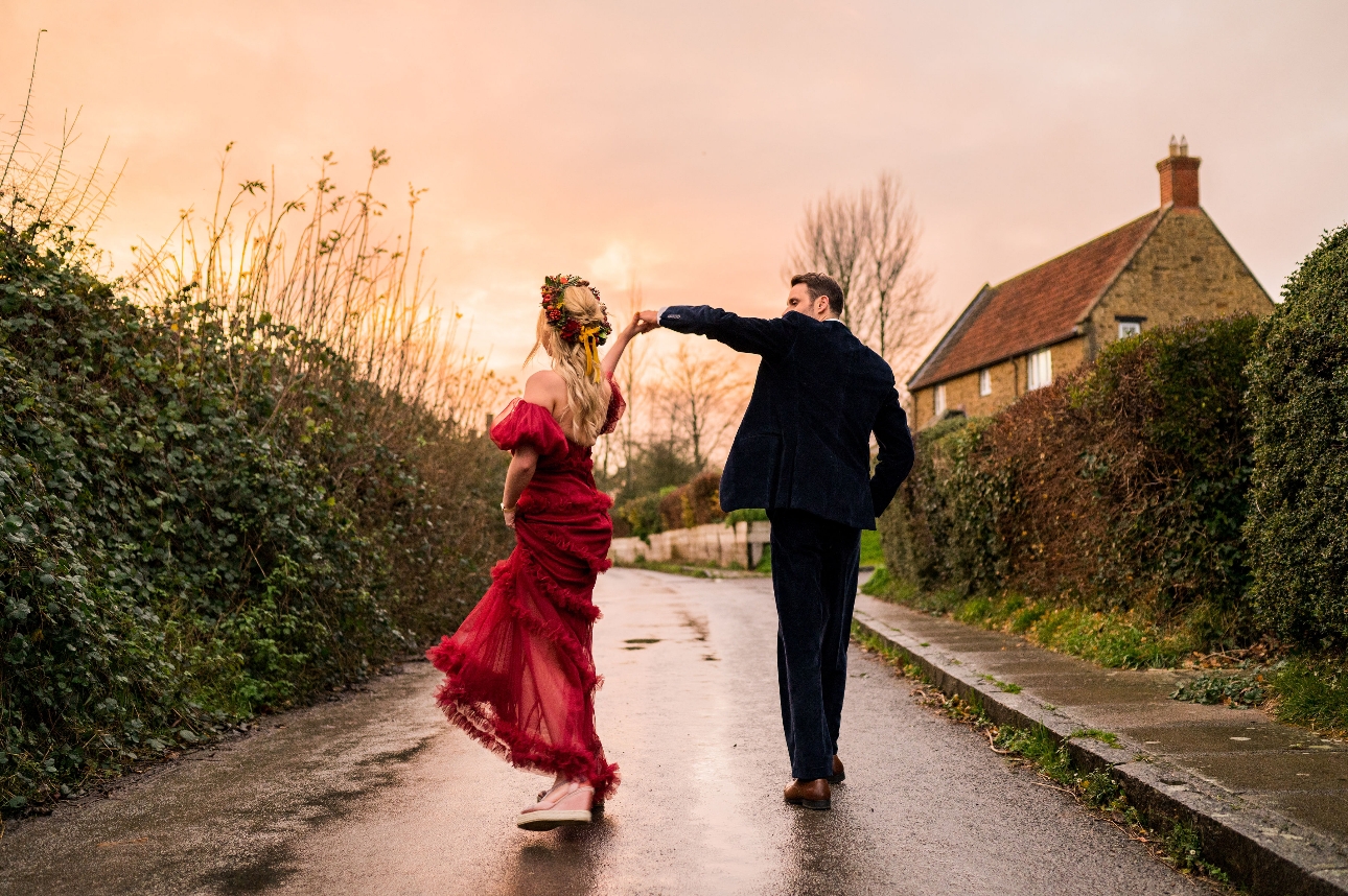 Groom twirls bride