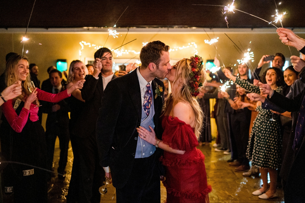 Couple kissing under sparklers