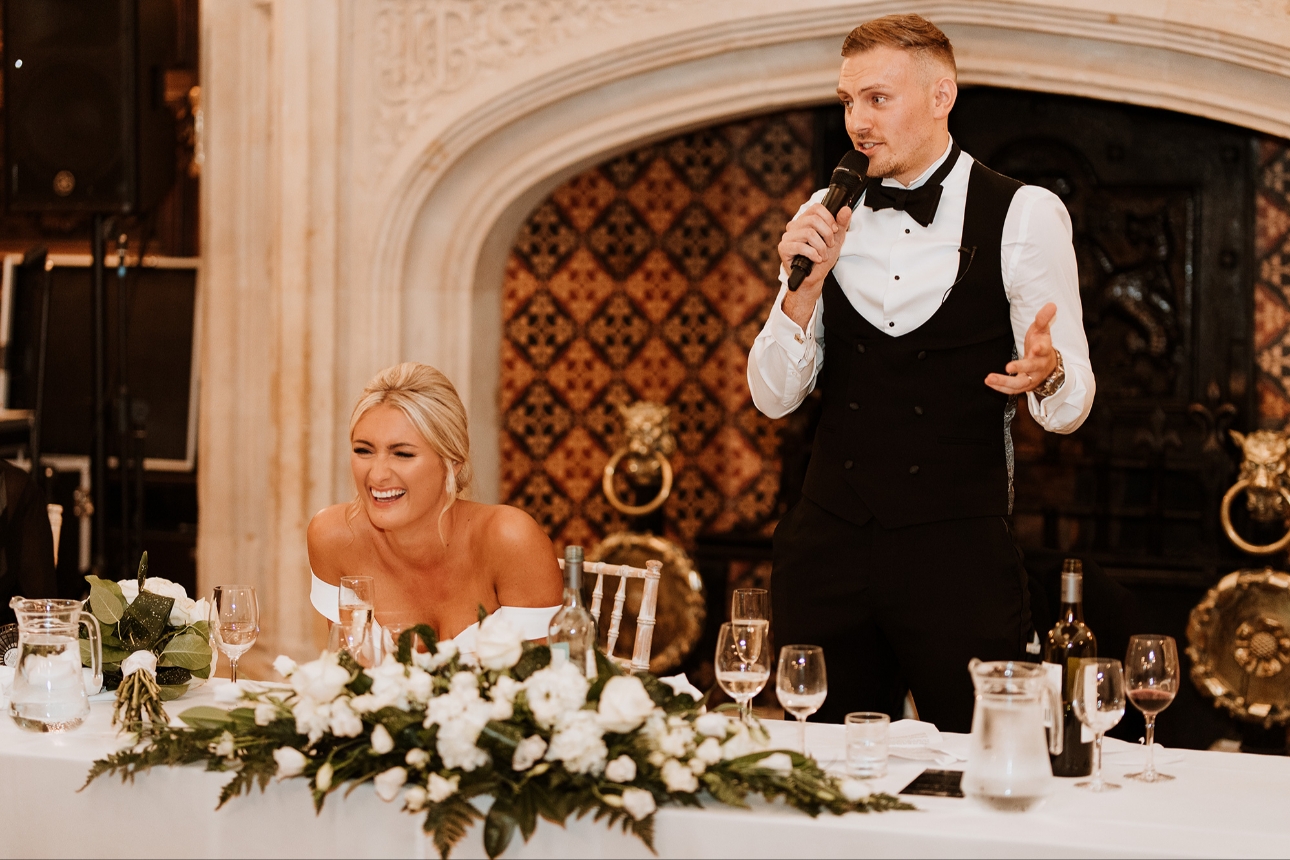 Bride laughing at groom's speech