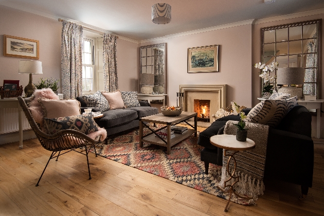 cosy lounge with lots of seating with log fire etc