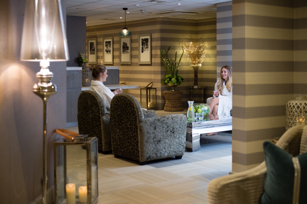 two people sat in chairs in a spa waiting room