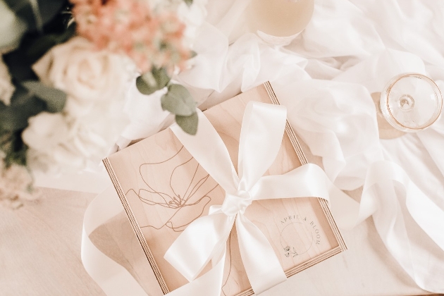 wooden box wrapped in white bow