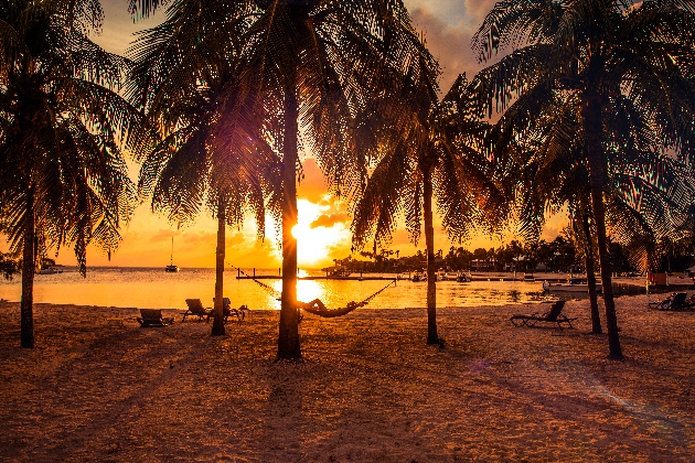 A woman relaxing on hammock after a beach day in the Caribbean