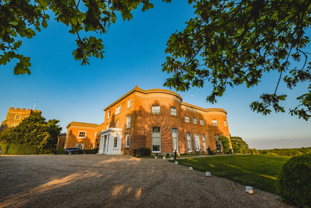 historic wedding venue curved sections to front red brick gravel drive