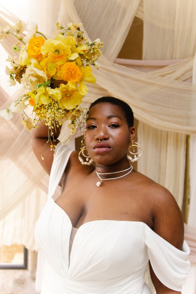 model holding bridal bouquet