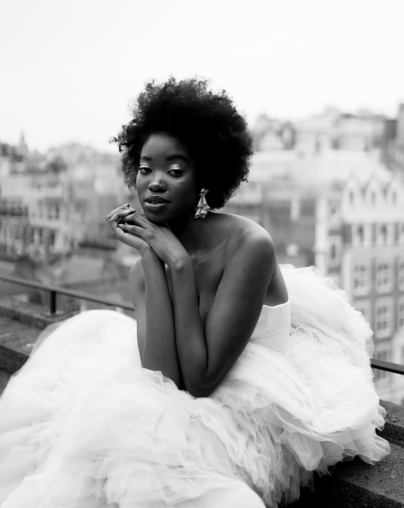 model in white tulle dress with big layered skirt black and white image