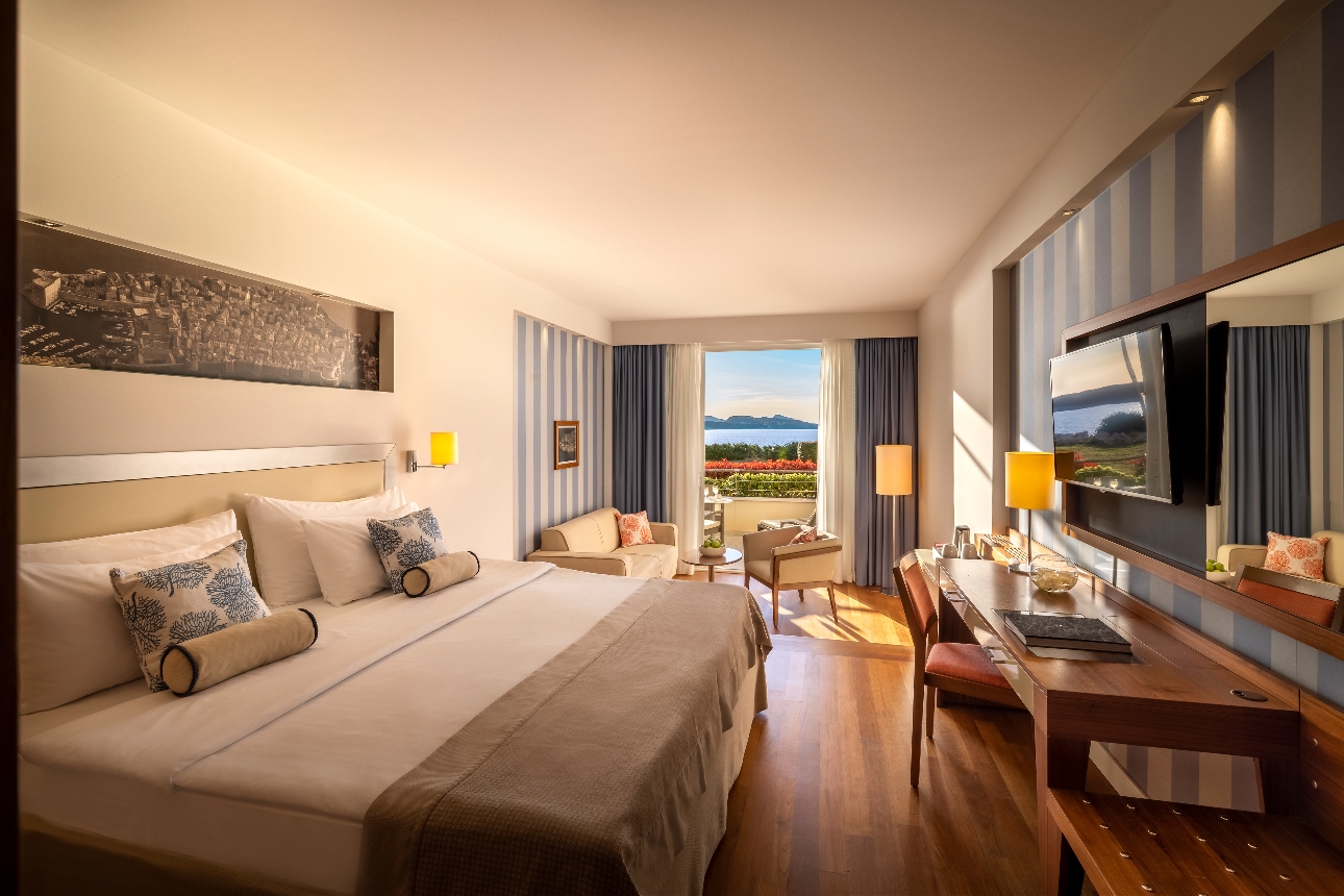 hotel bedroom, double bed, sofa, balcony, views of sea