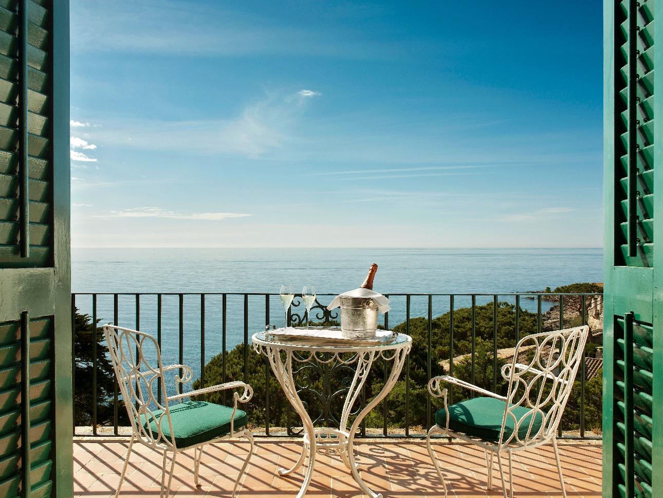 balcony with table and chairs on it and sea views