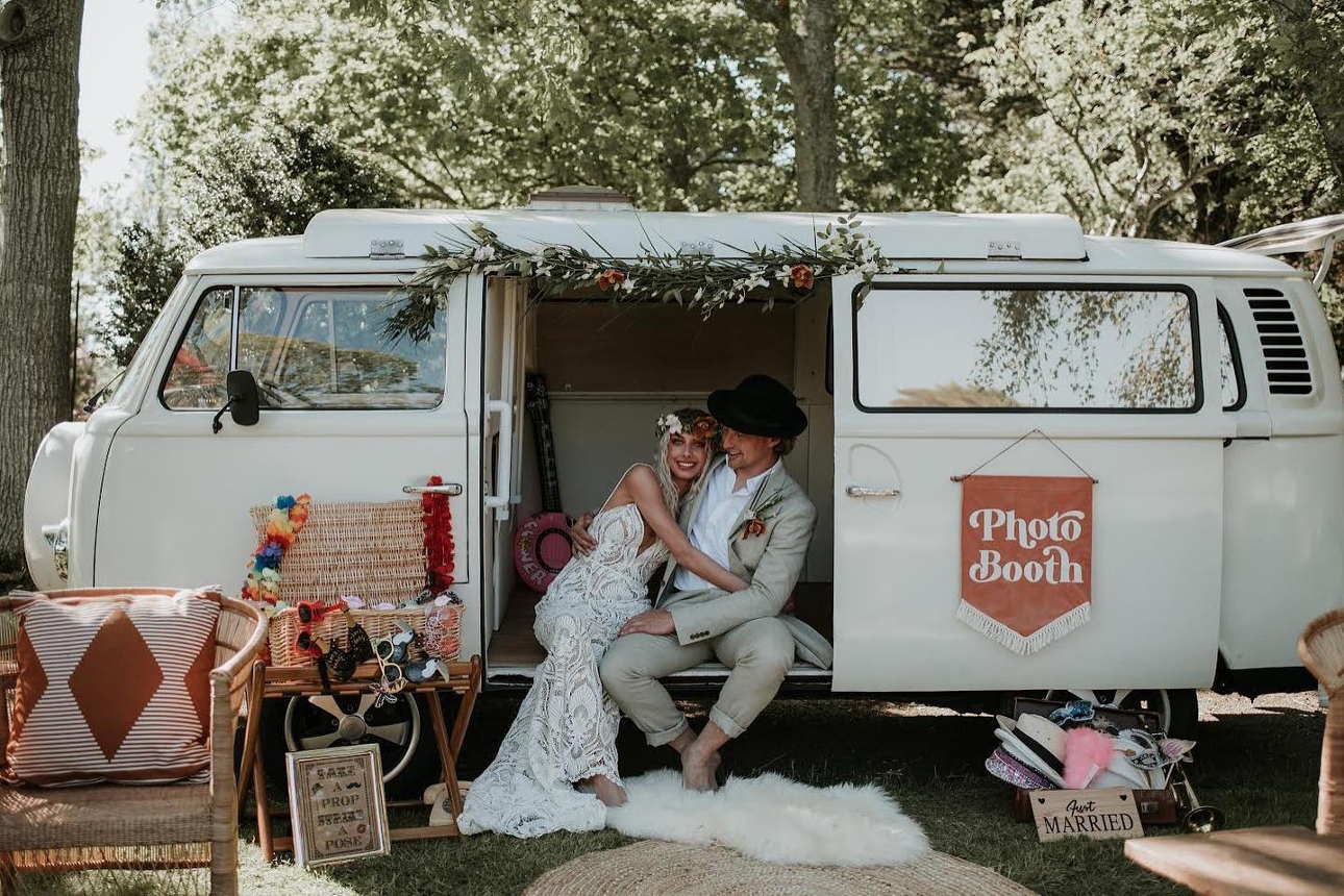 boho wedding couple in a camper van with vintage decor