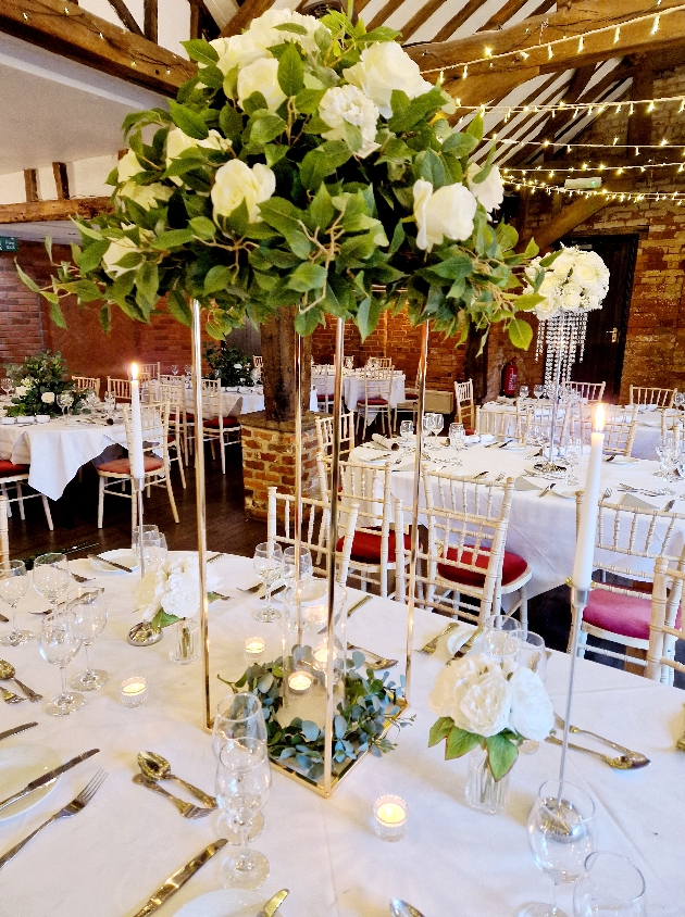 tall floral centrepiece with gold frame 