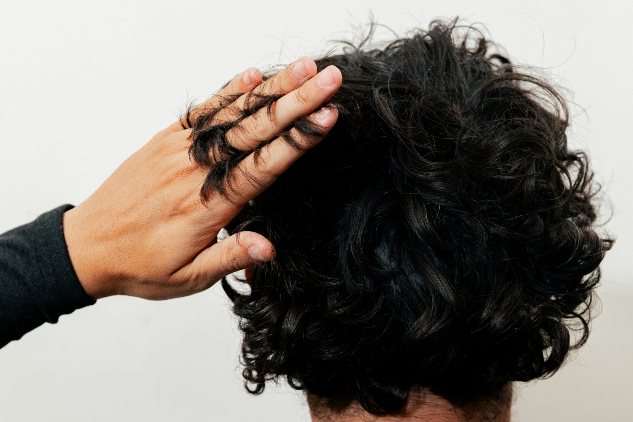 A man pulling his hair