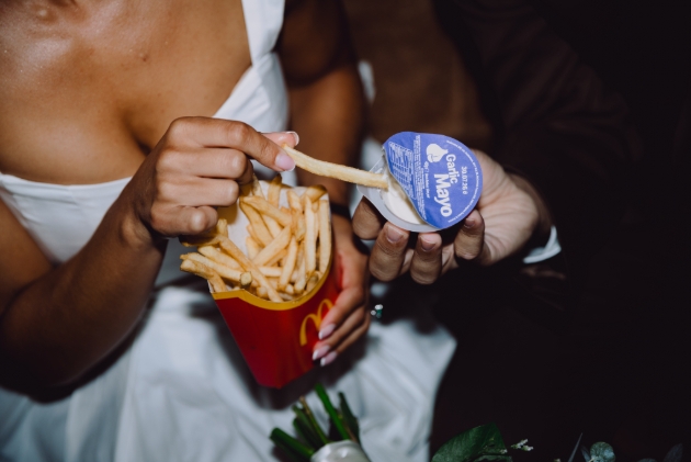Couple enjoying McDonald's garlic mayo dip