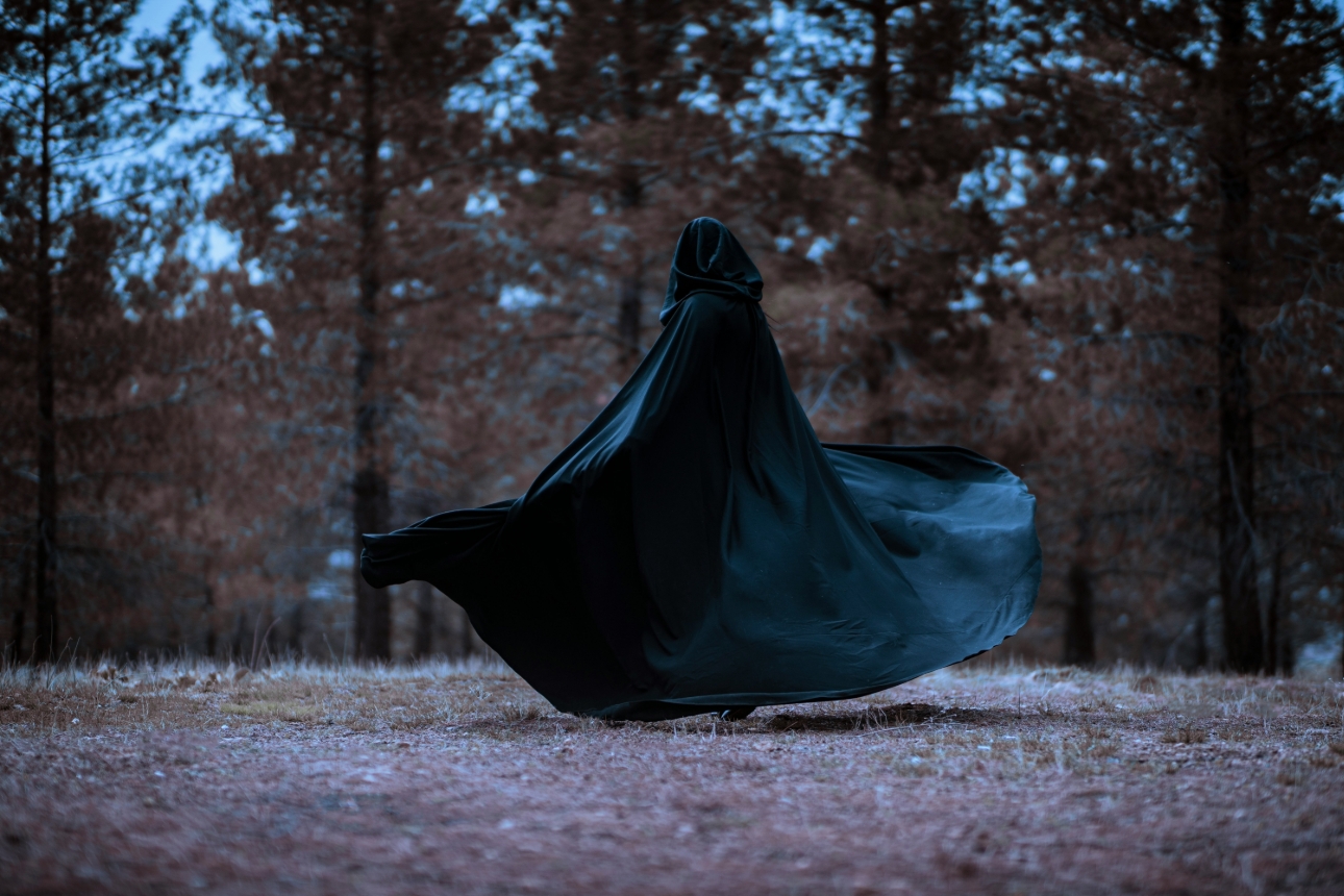 Traitor cloak on persons in woods